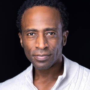 Male Professional in a White Sweater